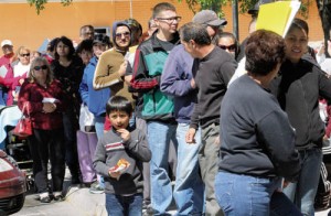 People wait in line outside the Centro San Vicente at 8061 Alameda to sign up for the Affordable Care Act -  credit El Paso Times